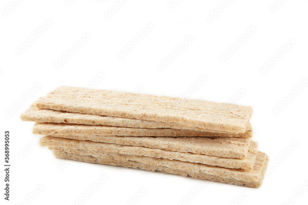 A slices of wheat crispbread isolated on white background. A slices of wheat crispbread isolated on white background.