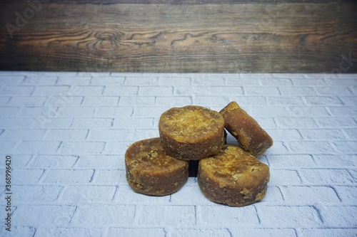 Pieces of brown sugar or brown sugar. Used for cooking spices from Asia