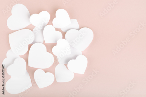 Paper hearts on pink background © azure