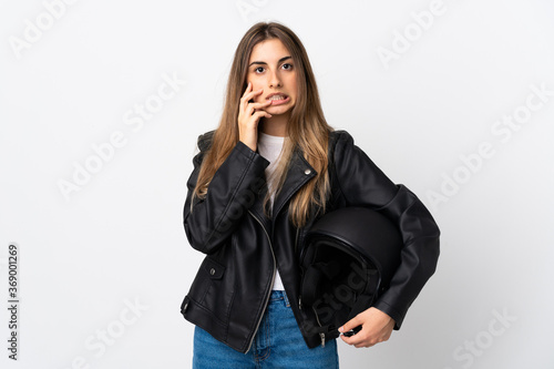 Young Woman holding a motorcycle helmet over isolated white background nervous and scared