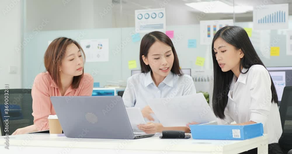 Business woman talking with team at modern office. She planning business project with her team. Business, Leadership, Finance, Startup and Teamwork concept. Business woman talking with team at modern office. She planning business project with her team. Business, Leadership, Finance, Startup and Teamwork concept.