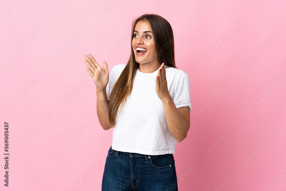 Young Uruguayan woman isolated on pink background with surprise facial expression Young Uruguayan woman isolated on pink background with surprise facial expression