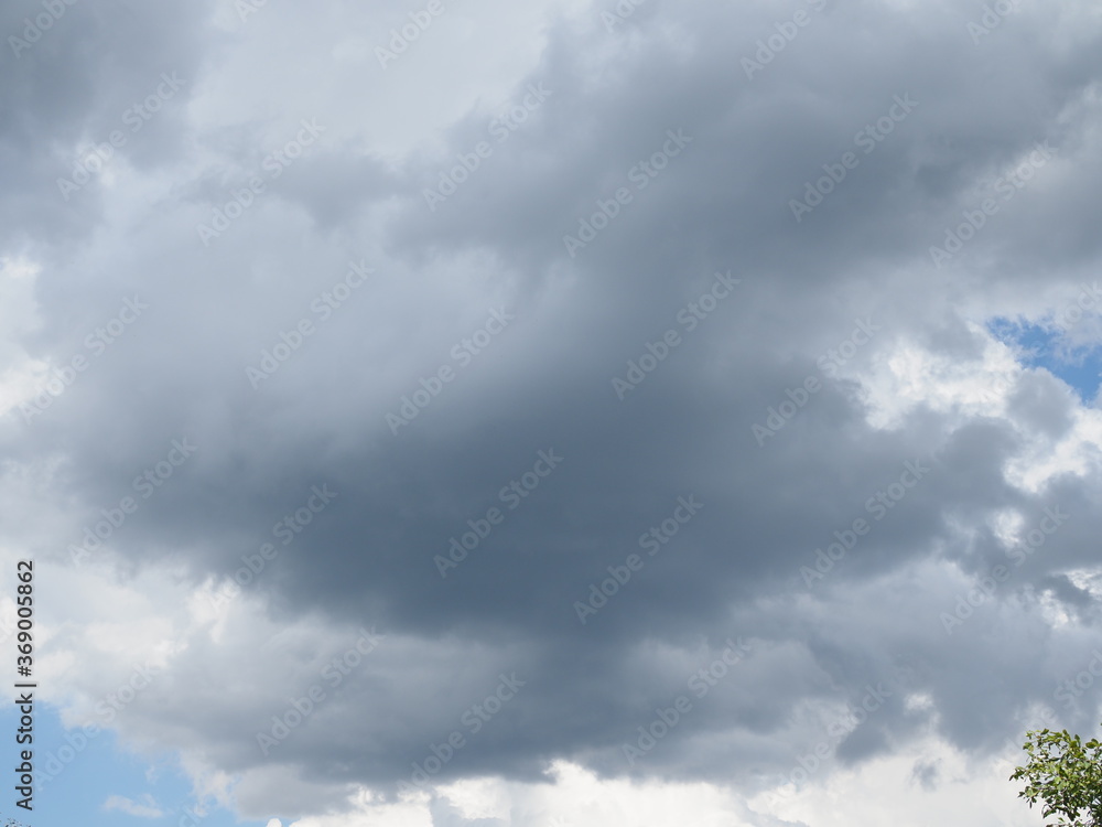 Fototapeta premium Cloudy sky full of deep grey clouds. Storm is coming.