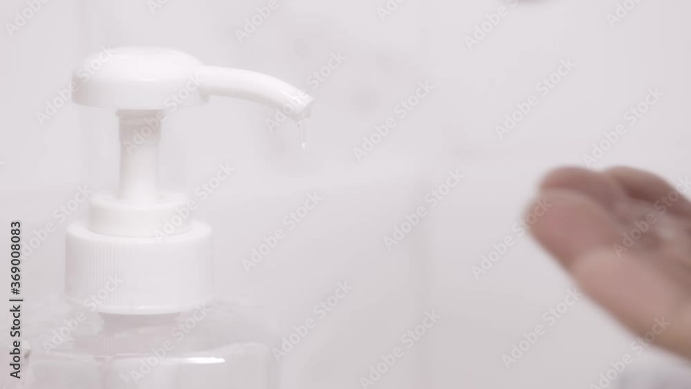 man using bottle of antibacterial sanitiser soap. alcohol gel pump dispenser rub cleaning hand hygiene prevention of coronavirus. outbreak on white background, health care concept. man using bottle of antibacterial sanitiser soap. alcohol gel pump dispenser rub cleaning hand hygiene prevention of coronavirus. outbreak on white background, health care concept.