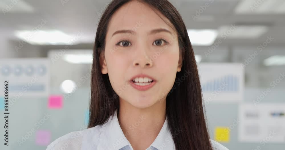 Portrait of business woman talking to camera at modern office. She using conference call to talk with team during covid-19 situation. Portrait of business woman talking to camera at modern office. She using conference call to talk with team during covid-19 situation.