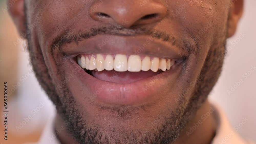 Close up of Lips of Smiling African Man Close up of Lips of Smiling African Man