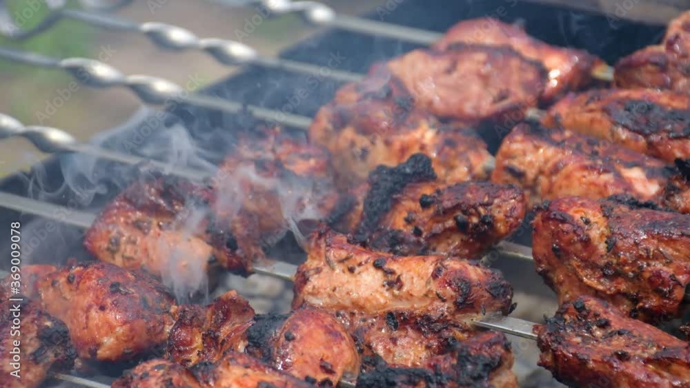 Cooking meat and delicious food concept. Meat on skewers. Marinated shashlik preparing on a barbecue grill over charcoal. Appetizing meat grilled on skewers. Cooking shashlik. Grilling pork on coal Cooking meat and delicious food concept. Meat on skewers. Marinated shashlik preparing on a barbecue grill over charcoal. Appetizing meat grilled on skewers. Cooking shashlik. Grilling pork on coal