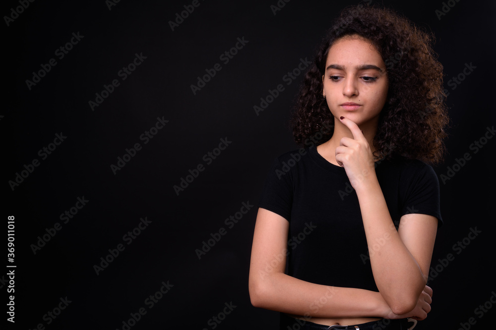 Portrait of young beautiful Persian teenage girl with curly hair Portrait of young beautiful Persian teenage girl with curly hair