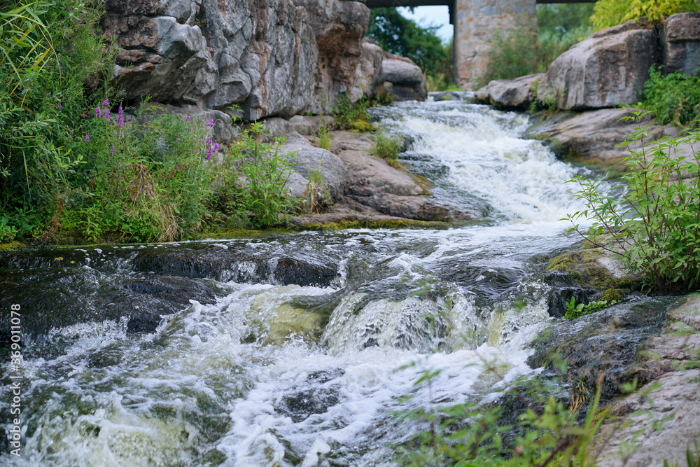 mountain stream waterfall and green moss on the stone mountain stream waterfall and green moss on the stone