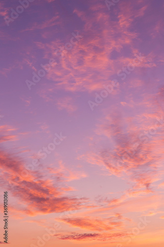Dramatic soft sunrise, sunset pink violet orange sky with clouds background texture © Viktor Iden