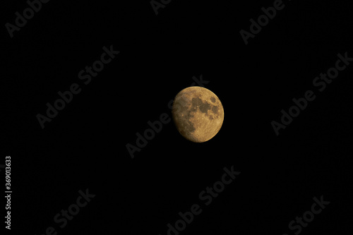 yellow moon with black sky