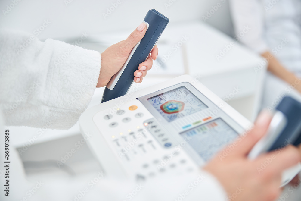 Portrait of woman hands on the modern technology device that showing indicators of the health Portrait of woman hands on the modern technology device that showing indicators of the health