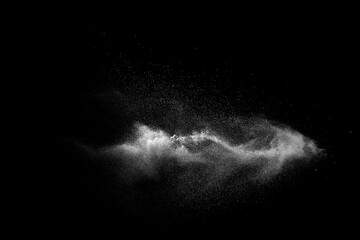 White talcume powder explosion on black background. White dust particles splash.