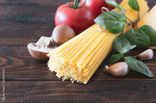 Spaghetti and ingredients for making pasta. Italian food concept. Copy space