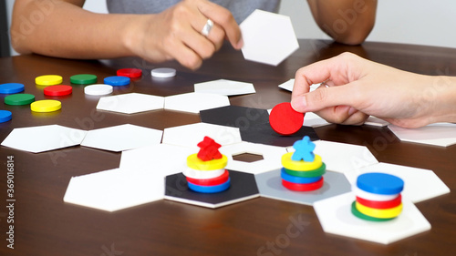 people play board game table top abstract strategy business plan design selected focus photo
