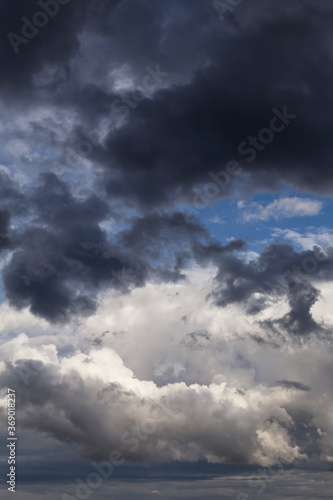 Epic Storm sky, dark grey and white rain cumulus clouds background texture