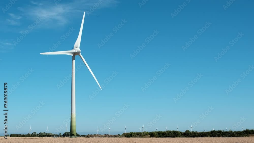 Electricity Wind turbines in a field of ripe and ready to harvest wheat. Electricity Wind turbines in a field of ripe and ready to harvest wheat.