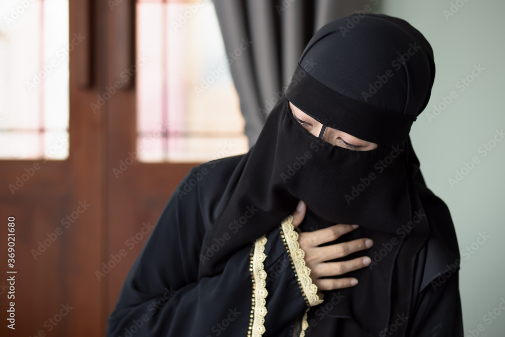 sick woman with indigestion problem, acid reflux or gerd symptoms; woman health care, body care, sickness, pain, acid reflux, covid-19 disease concept; muslim woman model with Middle Eastern dress sick woman with indigestion problem, acid reflux or gerd symptoms; woman health care, body care, sickness, pain, acid reflux, covid-19 disease concept; muslim woman model with Middle Eastern dress
