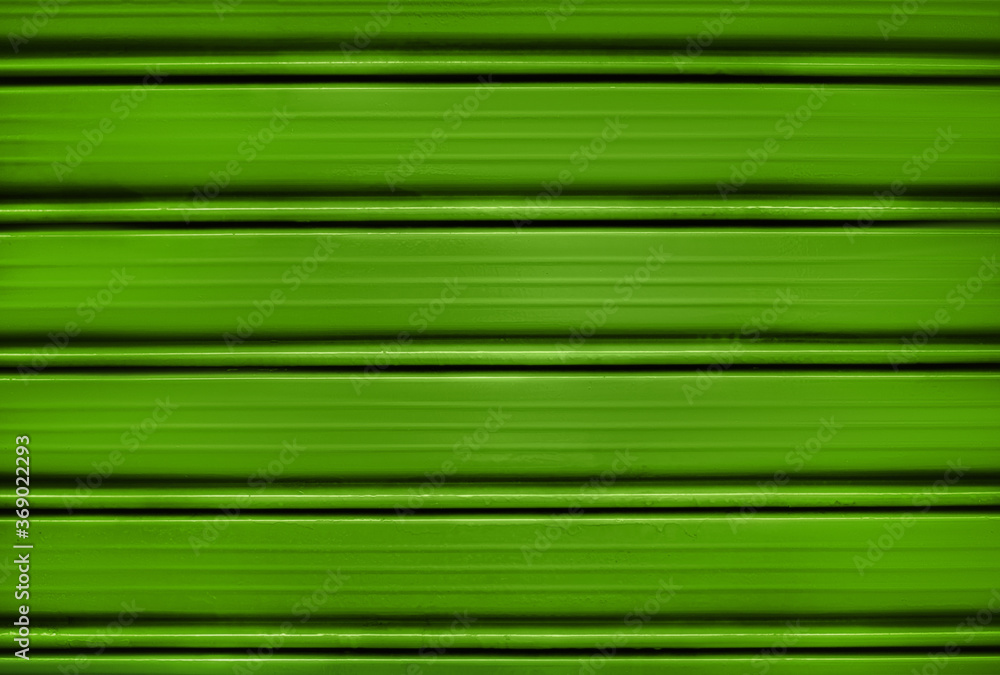 Bright green painted shutter or roller blind. Bright green painted shutter or roller blind.