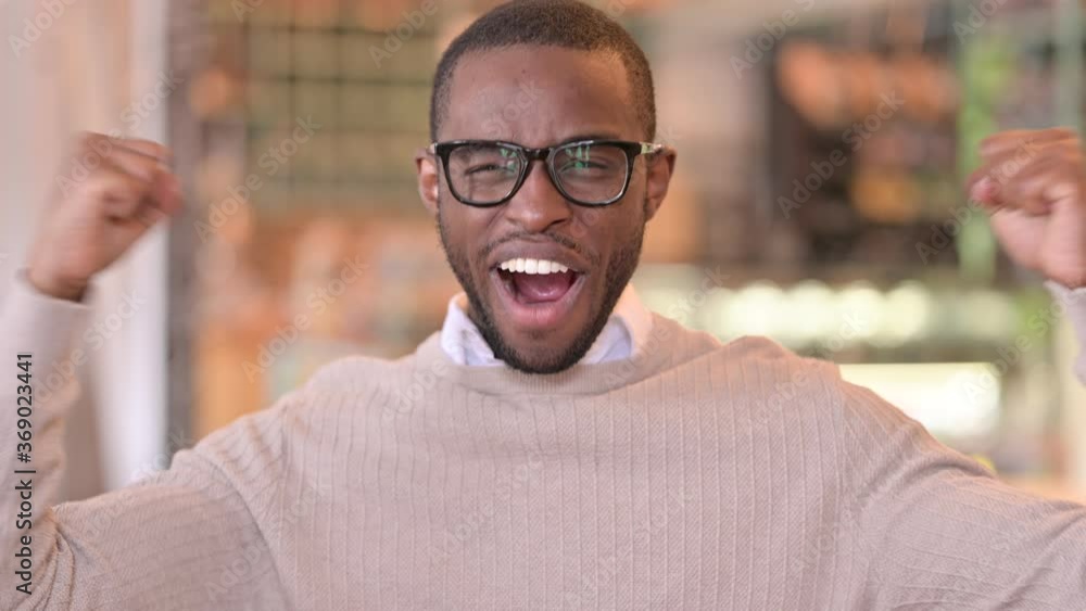 Portrait of Excited African Man Celebrating Success Portrait of Excited African Man Celebrating Success