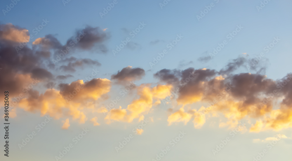Beautiful sky with clouds in summer at sunset