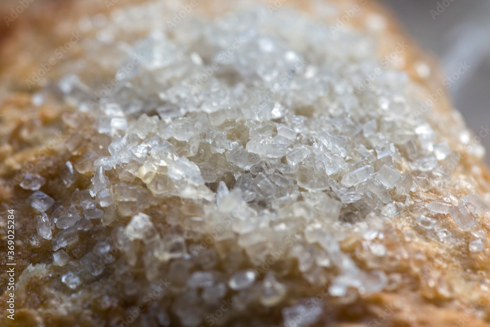 Close up on sugar granules on a pastry Close up on sugar granules on a pastry