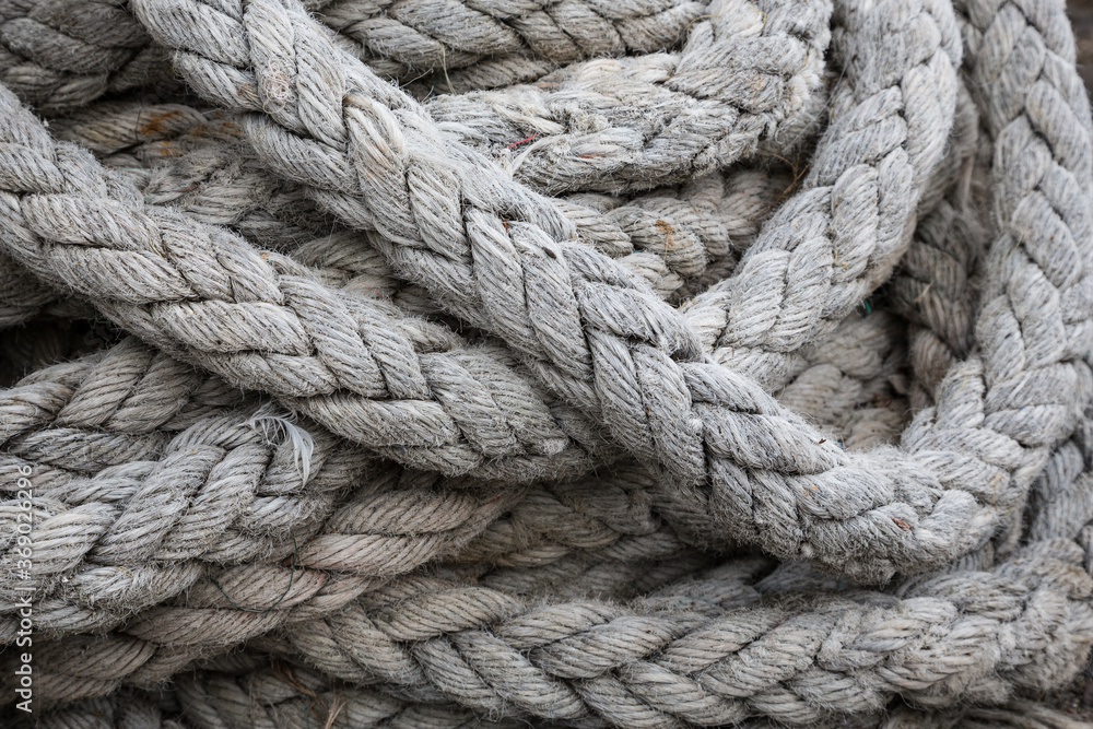 Closeup view of fisherman's rope piled in harbour of Clovelly, Devon UK Closeup view of fisherman's rope piled in harbour of Clovelly, Devon UK