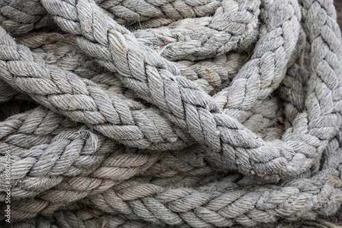 Closeup view of fisherman's rope piled in harbour of Clovelly, Devon UK