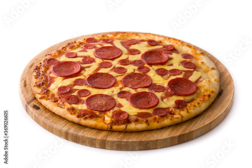 Italian pepperoni pizza on round wooden base isolated on white background
