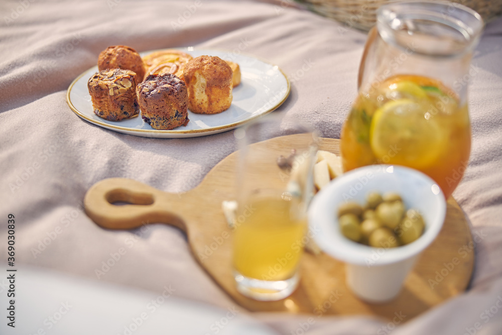 Fresh pastries on the white plate near the cold drink Fresh pastries on the white plate near the cold drink