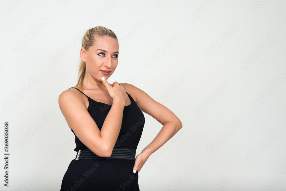 Portrait of young beautiful blonde woman against white background Portrait of young beautiful blonde woman against white background