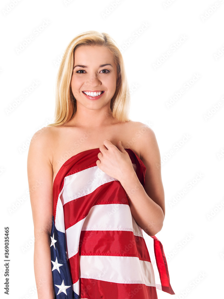 Beautiful blond woman wrapped only in an American flag. Beautiful blond woman wrapped only in an American flag.