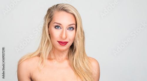 Portrait of young beautiful blonde woman shirtless