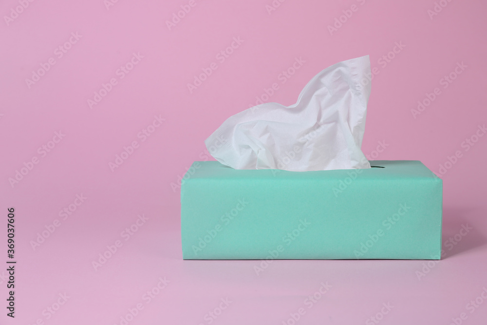 Box with paper tissues on pink background Box with paper tissues on pink background