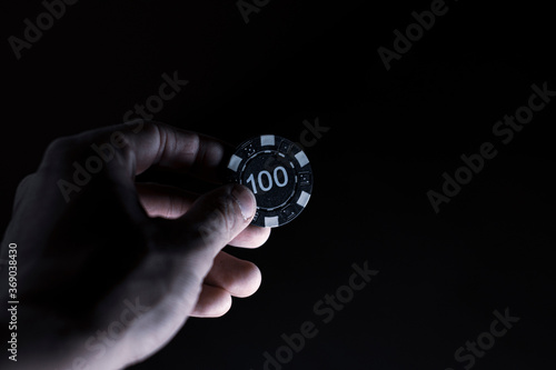 hand holding casino chips