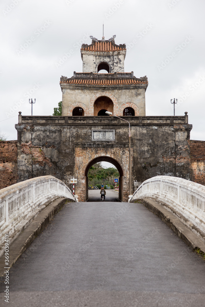 Hue, ancient capital of Vietnam. Ancient Citadel with gate and national flag.