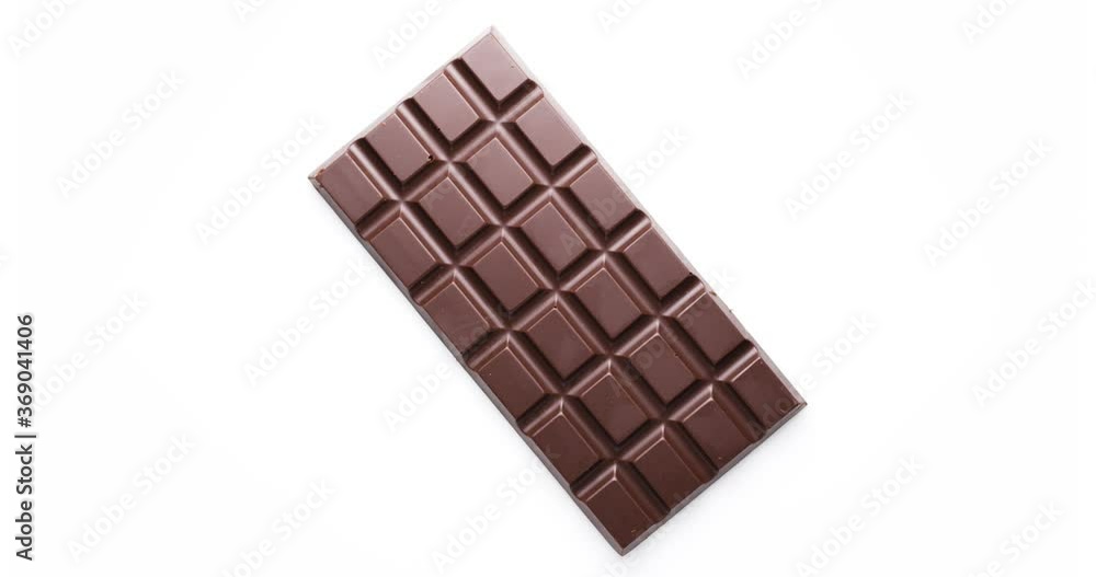 Whole bar of chocolate isolated on white background, rotates 360 degrees clockwise. Whole bar of chocolate isolated on white background, rotates 360 degrees clockwise.