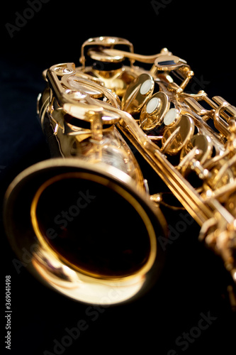 Close up of an alto saxophone isolated on a black background