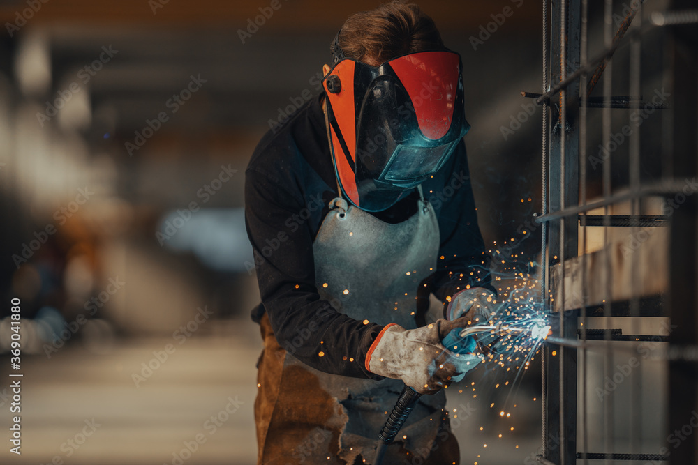 Experienced welder works in the factory