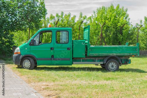 Green pickup truck with yellow flashing light