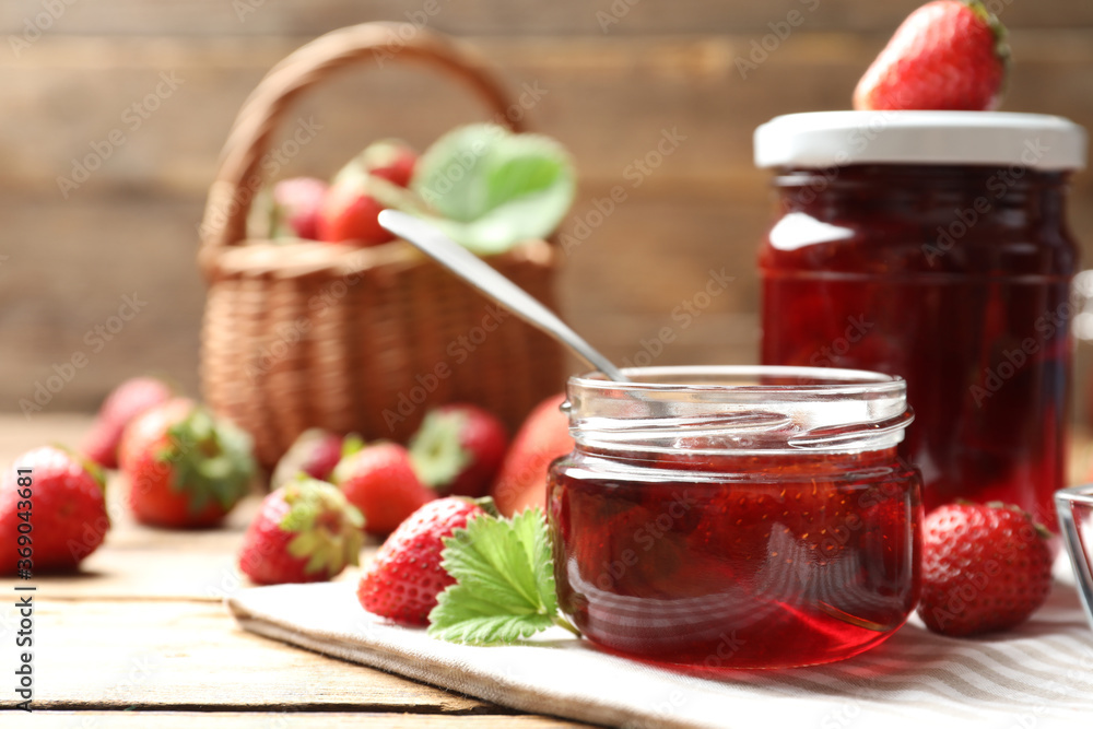 Delicious pickled strawberry jam and fresh berries on wooden table Delicious pickled strawberry jam and fresh berries on wooden table