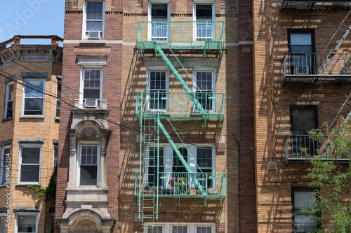 Old Brick Apartment Buildings with Fire Escapes in Astoria Queens New York
