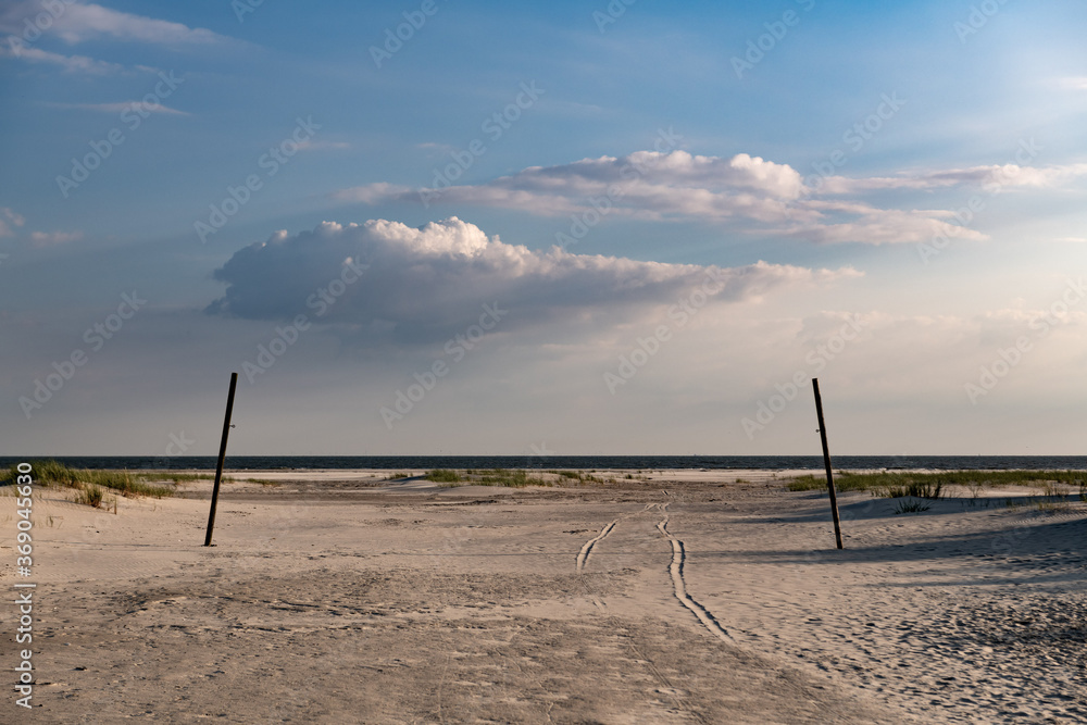 Mystic path over sand field through two pillars to beach with dramatic cloud. Mystic path over sand field through two pillars to beach with dramatic cloud.