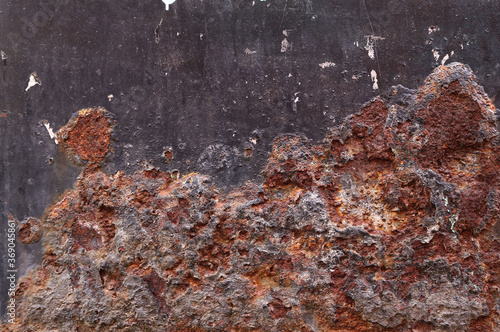 rusty metal surface with red, black, brown and orange tones - worn steampunk texture with dirty metallic background