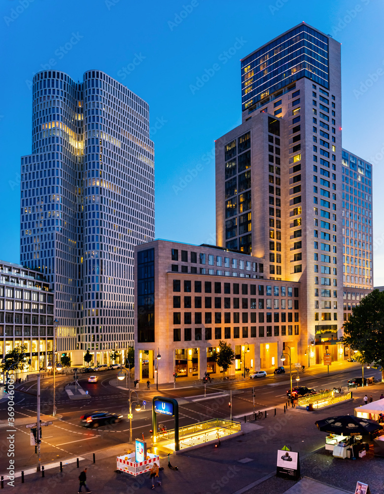 Modern skyscrapers in Berlin near the Zoologischer Garten after sunset.