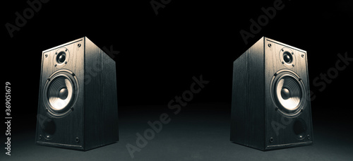 Canvas-taulu Two sound speakers with free space between them on black background