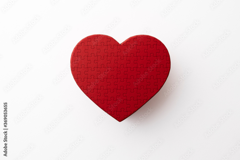 red heart shaped puzzle on white background