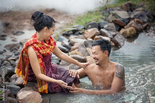 Couple Love are Enjoyment bathing Together in The river at Countryside, Lifestyles and Thai Culture 