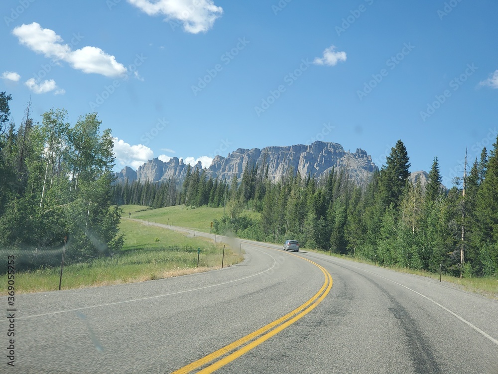 Rock formation and trees along the highway in Wyoming
