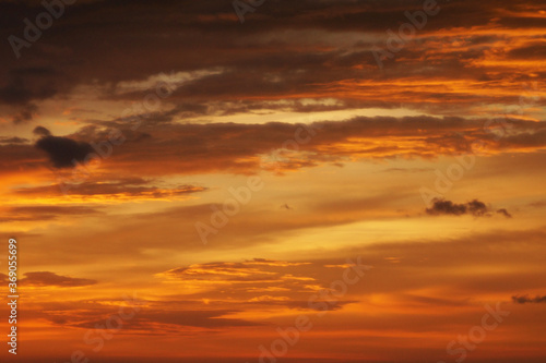Fototapeta Naklejka Na Ścianę i Meble -  Sunset lighting and orange sky with cloud as background